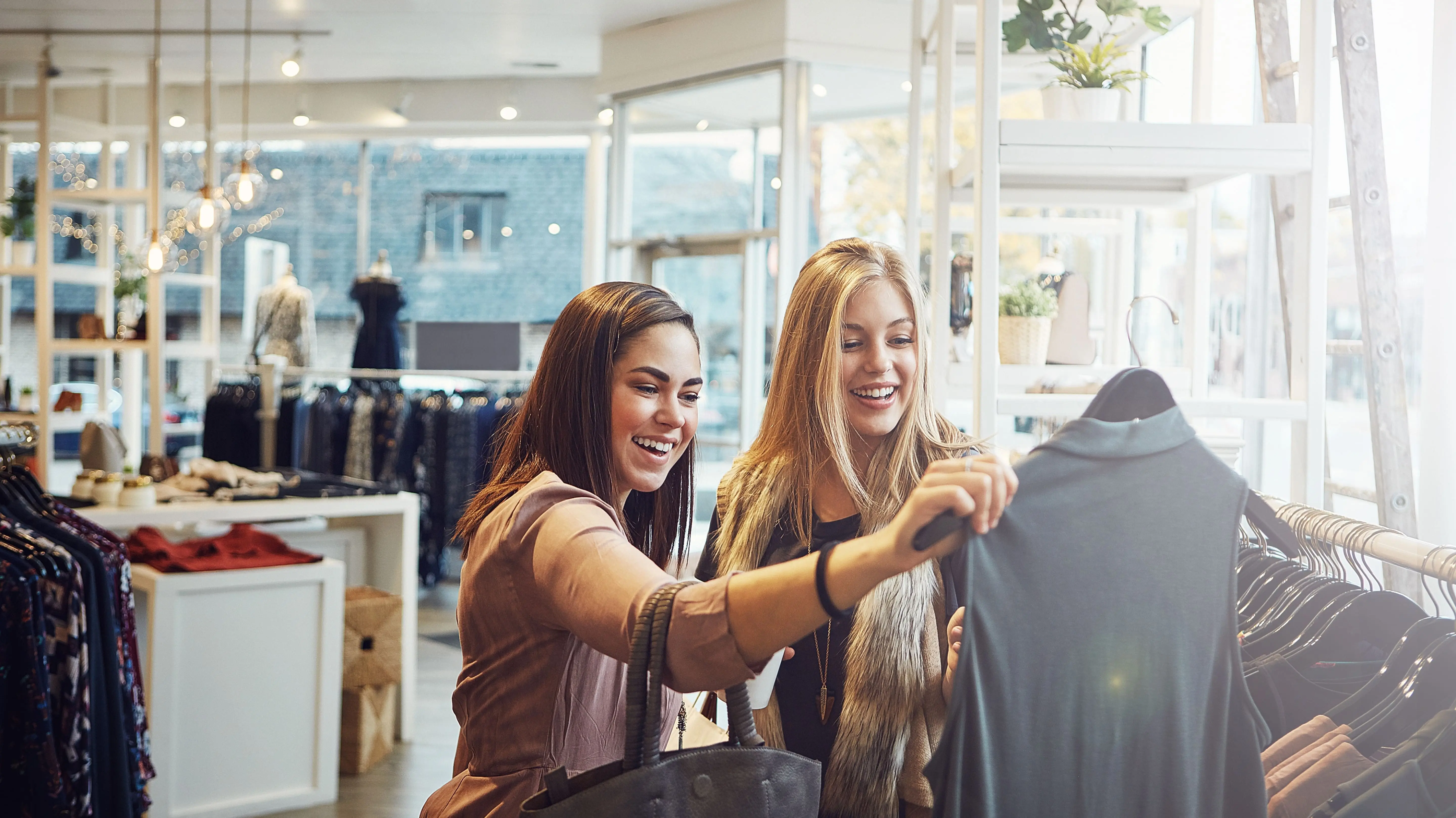 Two women shopping in a luxurious shop.