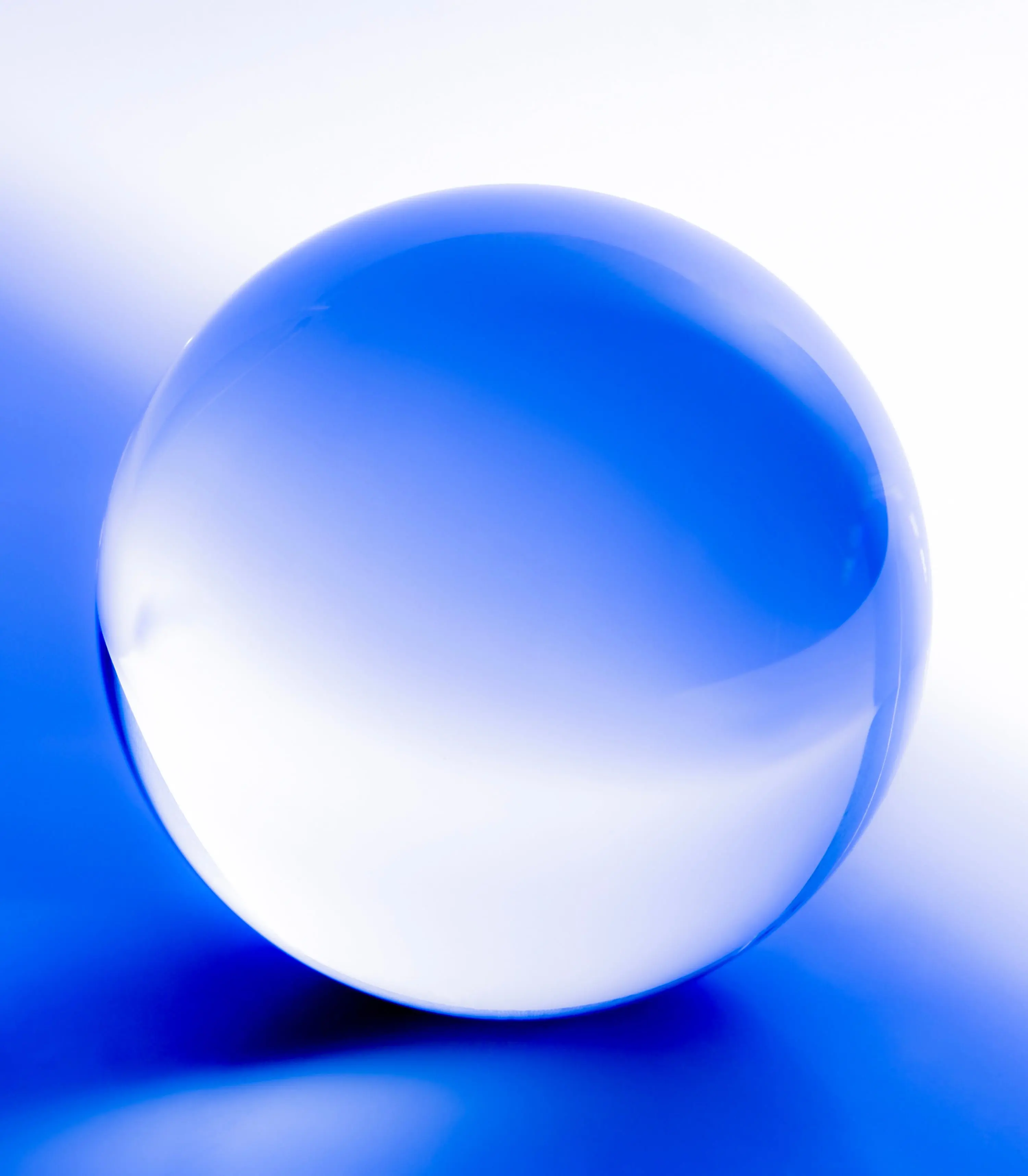Crystal ball. Glass ball in abstract blue with reflections.