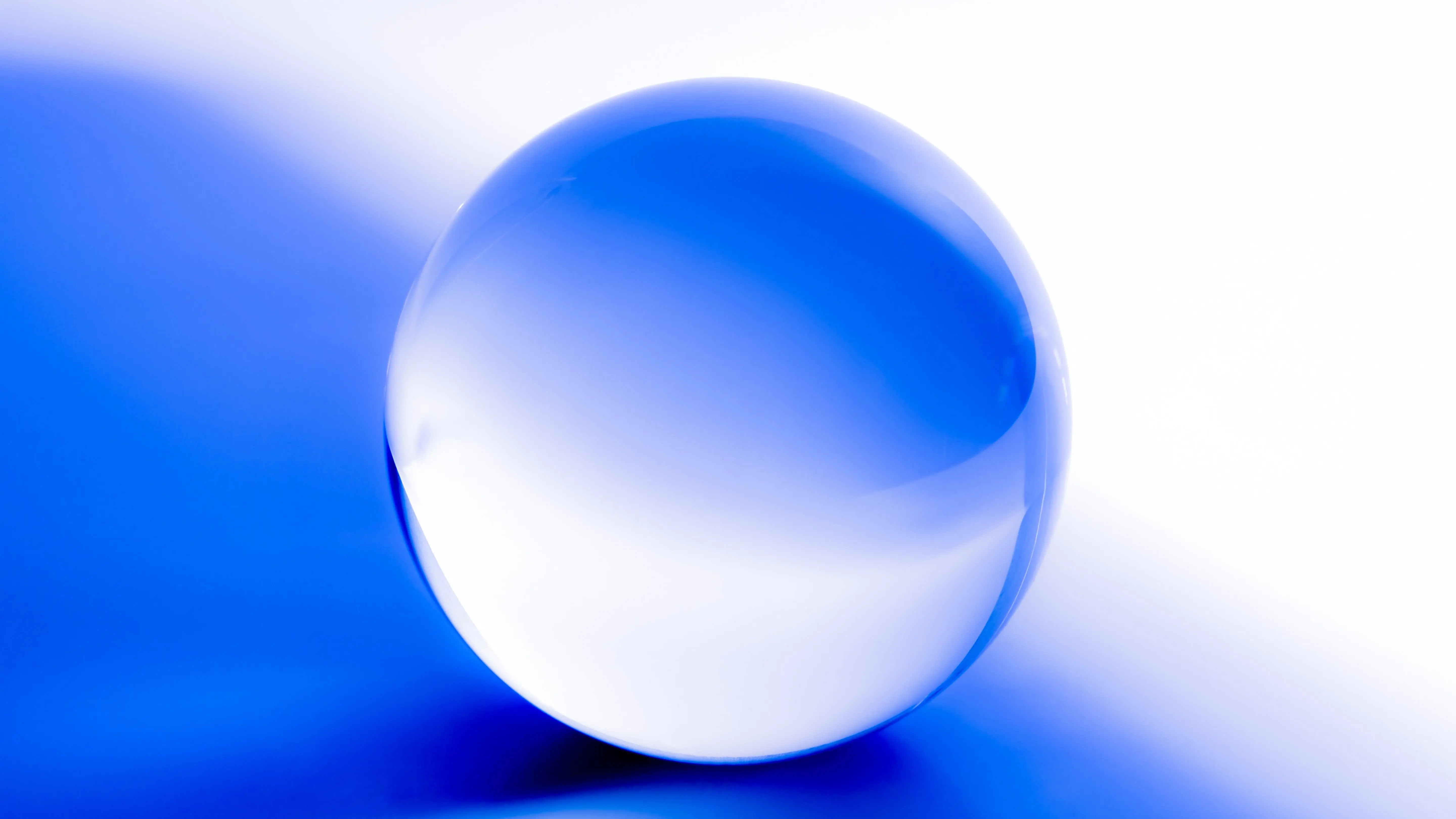 Crystal ball. Glass ball in abstract blue with reflections.