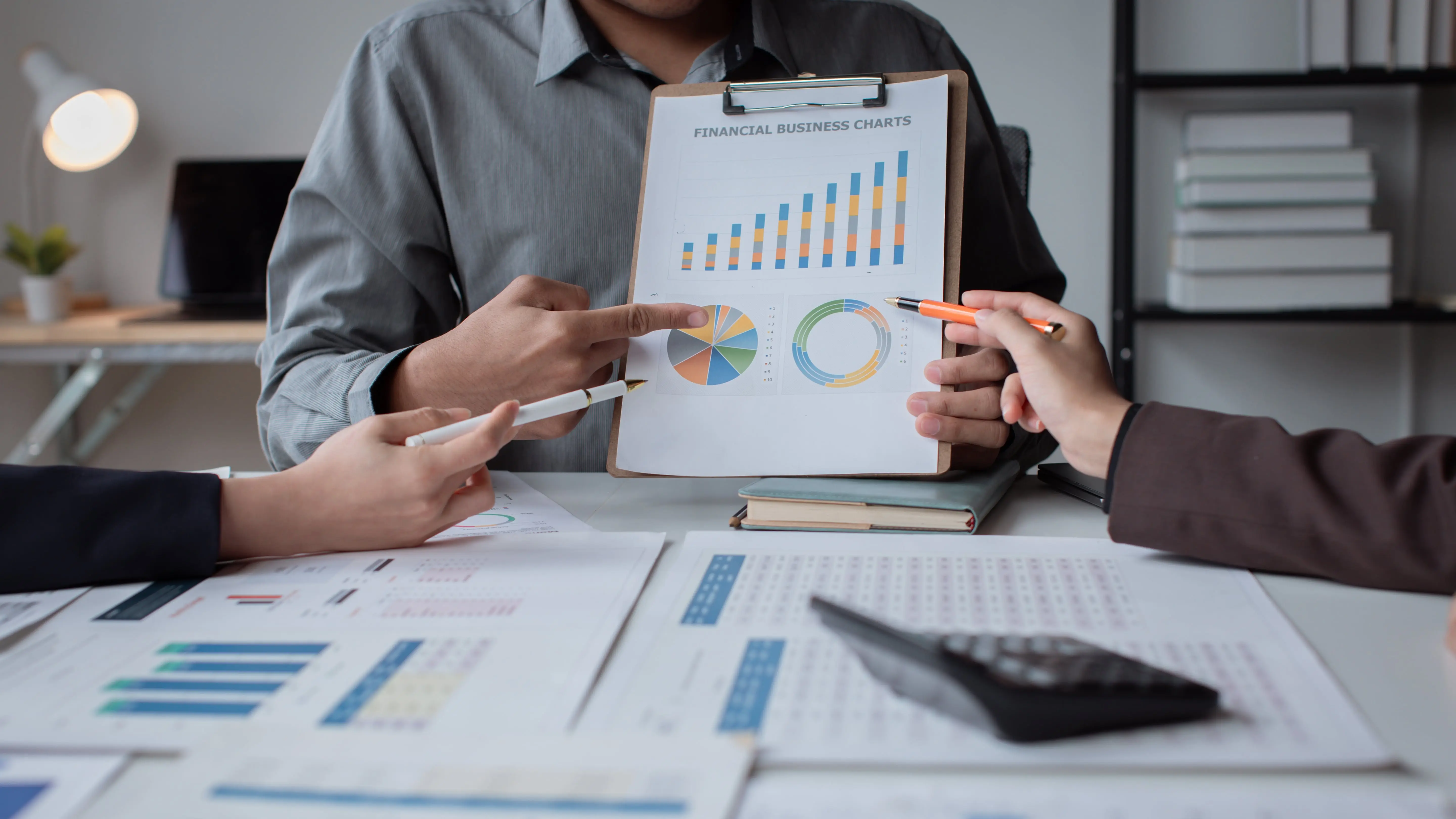 Group of asian business people working together in creative office analyze market data balance sheet account net profit.