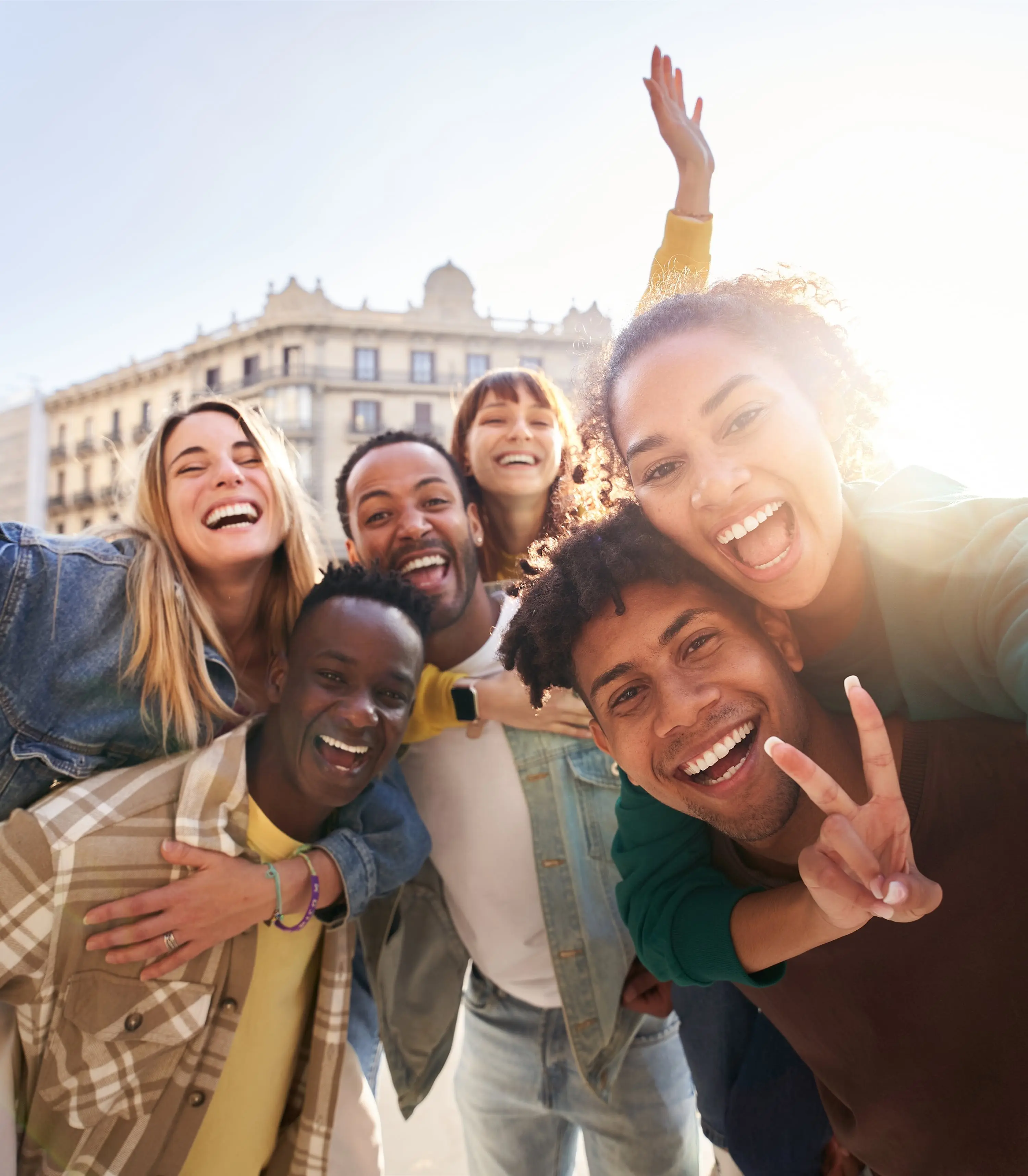 Cheerful gen z students having fun together looking at the camera.