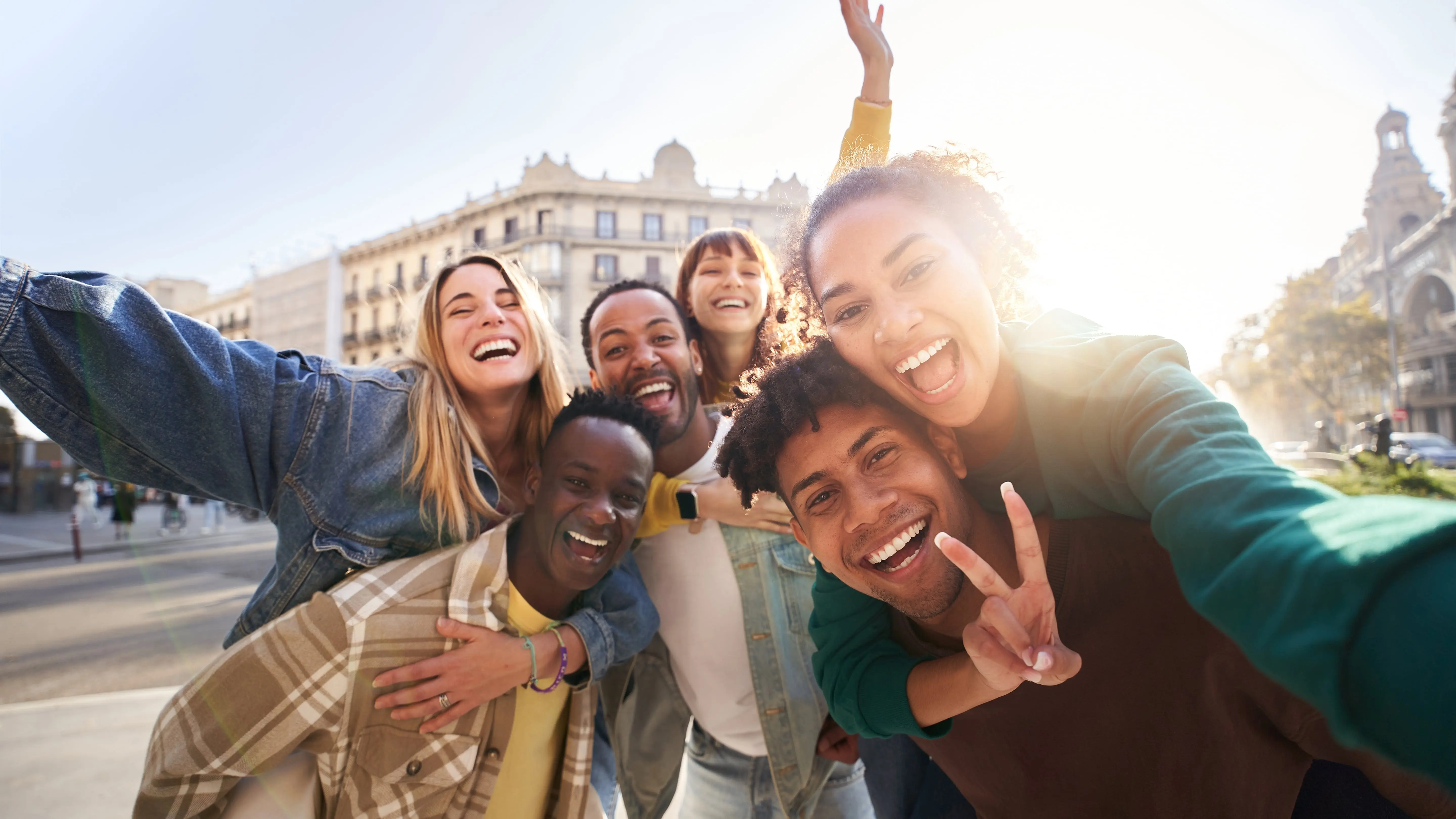 Cheerful gen z students having fun together looking at the camera.
